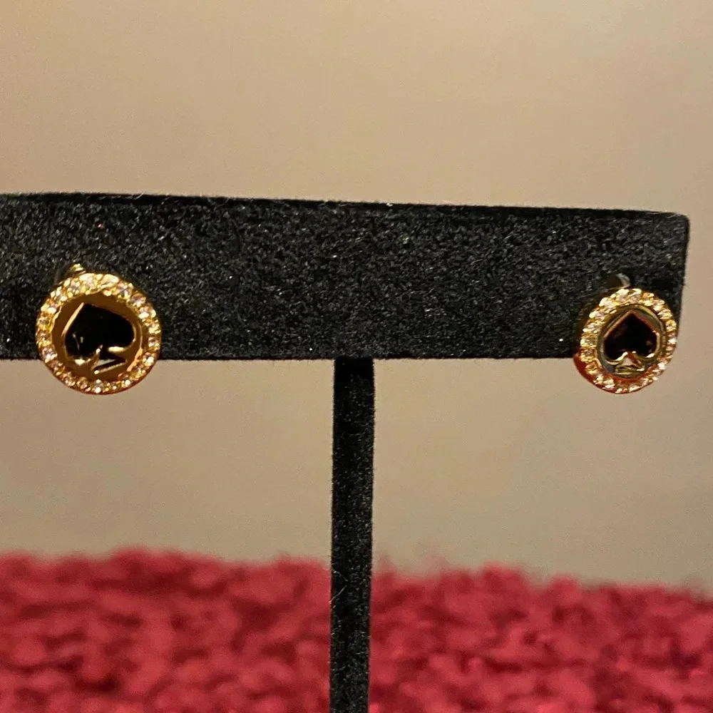 Kate Spade “spot the spade” gold tone earrings with spade cut out in the center